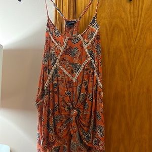 Burnt orange tank top with adjustable straps, cream and blue design
